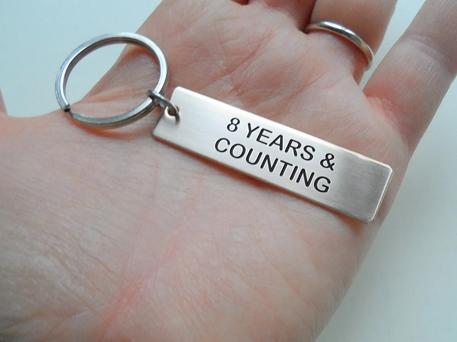 8 Year Anniversary Gift • Bronze Tag Keychain Engraved w/ "8 Years & Counting" by Jewelry Everyday