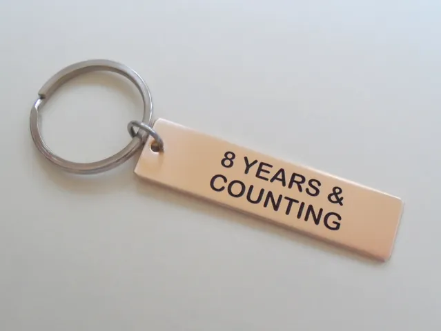 8 Year Anniversary Gift • Bronze Tag Keychain Engraved w/ "8 Years & Counting" by Jewelry Everyday